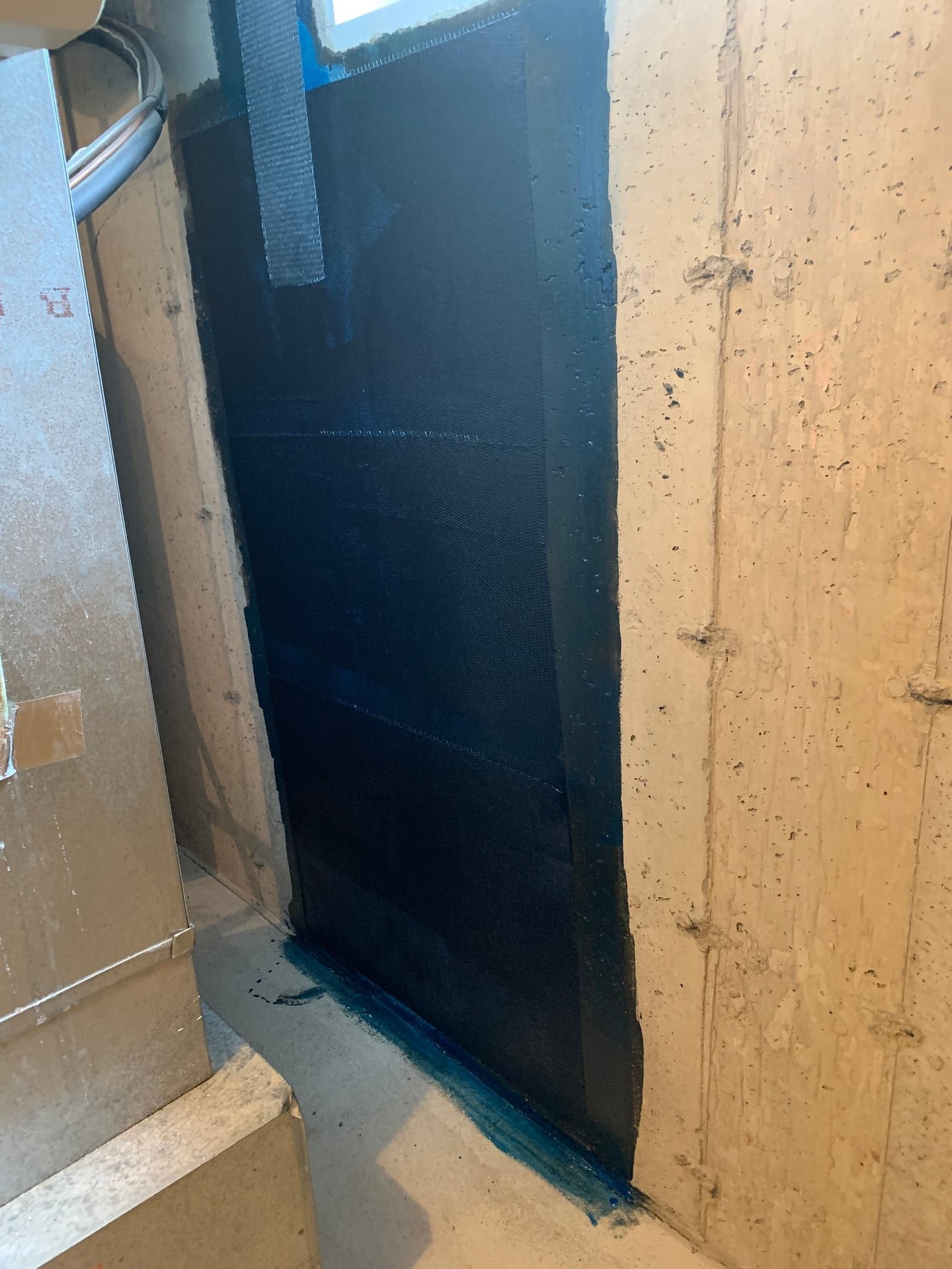 After: structural basement wall crack repair with epoxy injection and carbon fiber strap reinforcement in Ardsley, NY
