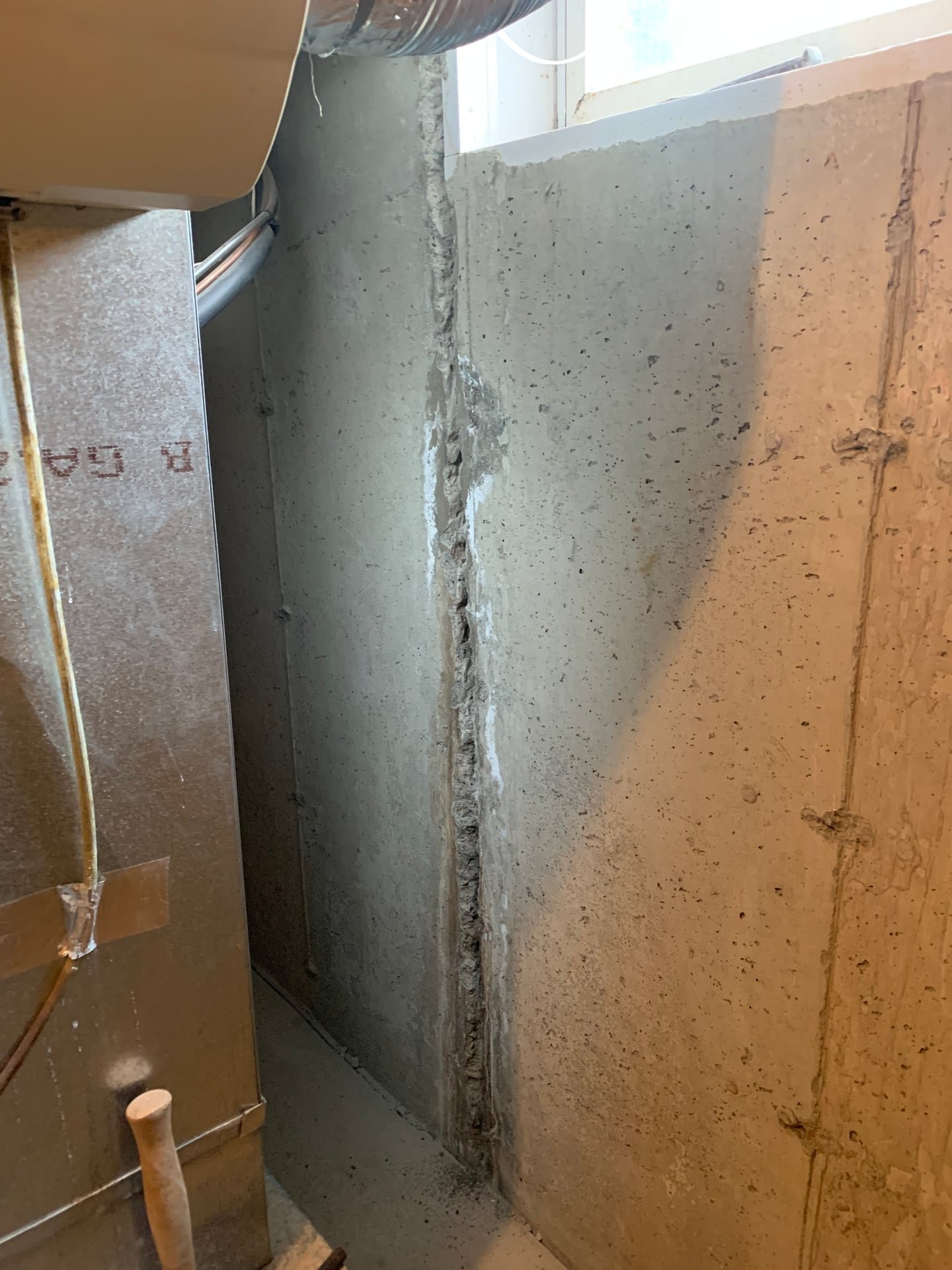 Before: structural basement wall crack repair with epoxy injection and carbon fiber strap reinforcement in Ardsley, NY