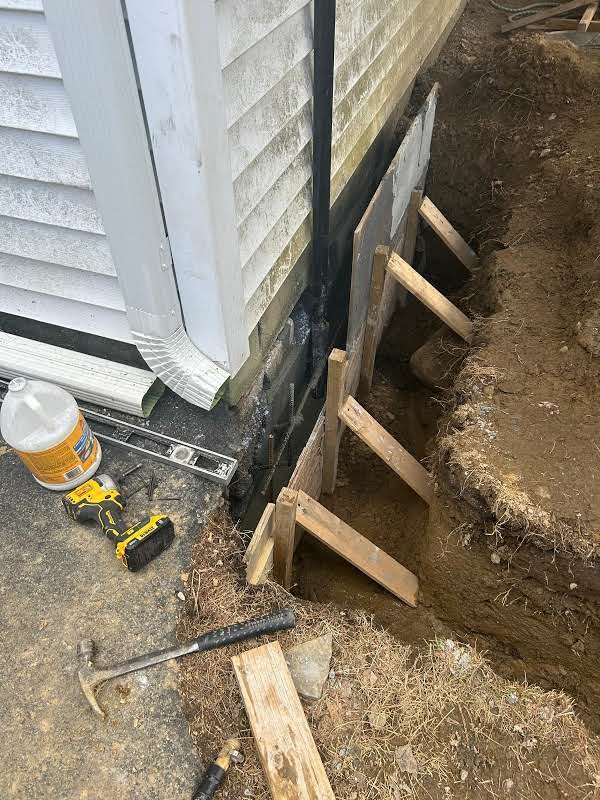 leaking foundation crack repair with exterior excavation, masonry rebuild and waterproofing membrane in Carmel, NY — after