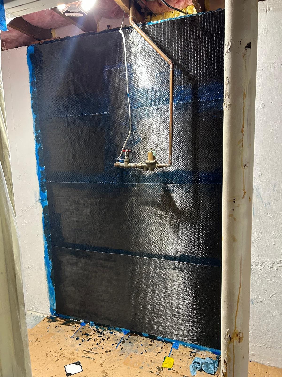 full-wall carbon fiber reinforcement on a cracked basement foundation wall in Shelton, CT — after