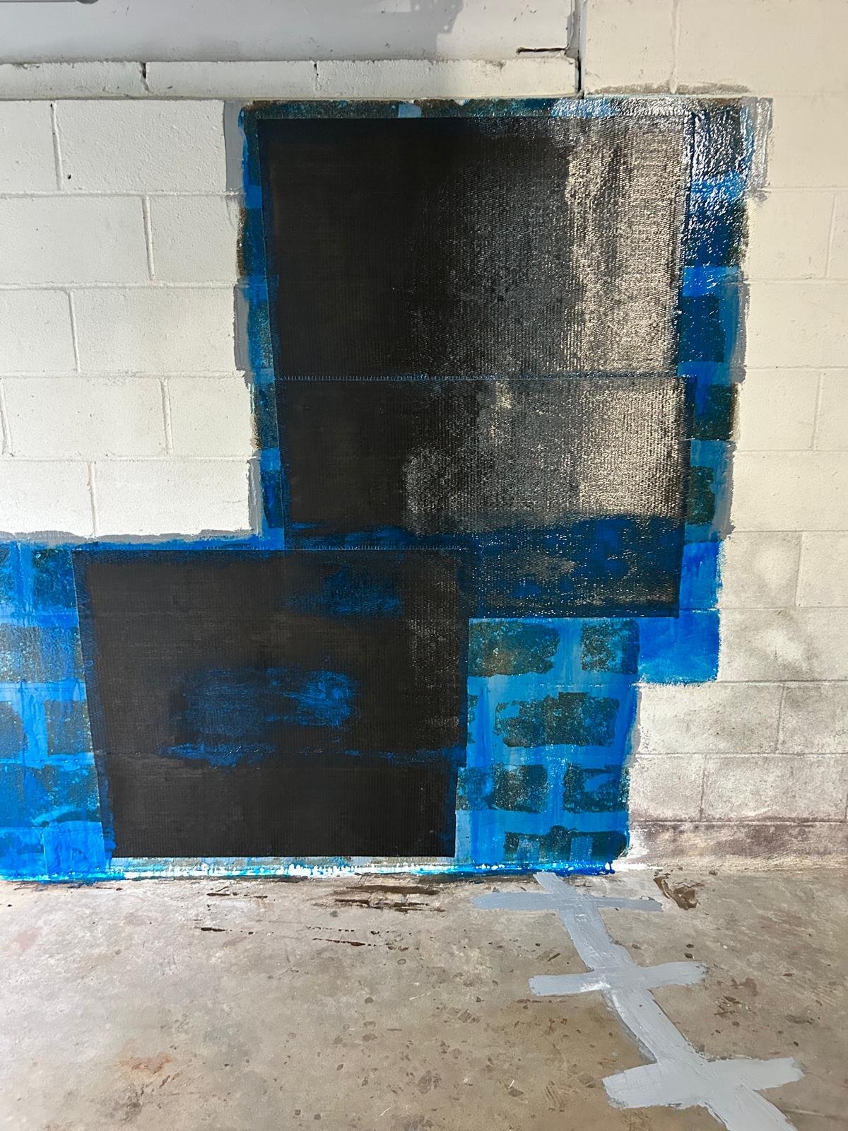 Job-site photo 1: basement block wall structural crack repair with carbon fiber mesh wraps in Weston, CT