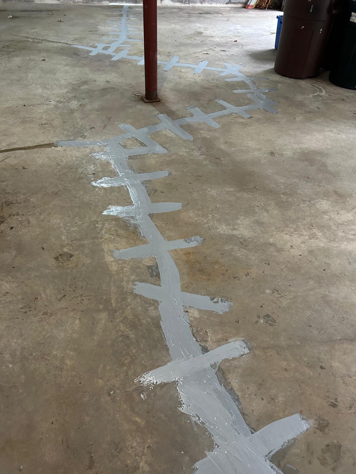After: garage slab structural crack stitched with carbon fiber and Kevlar stabilization bars in Weston, CT