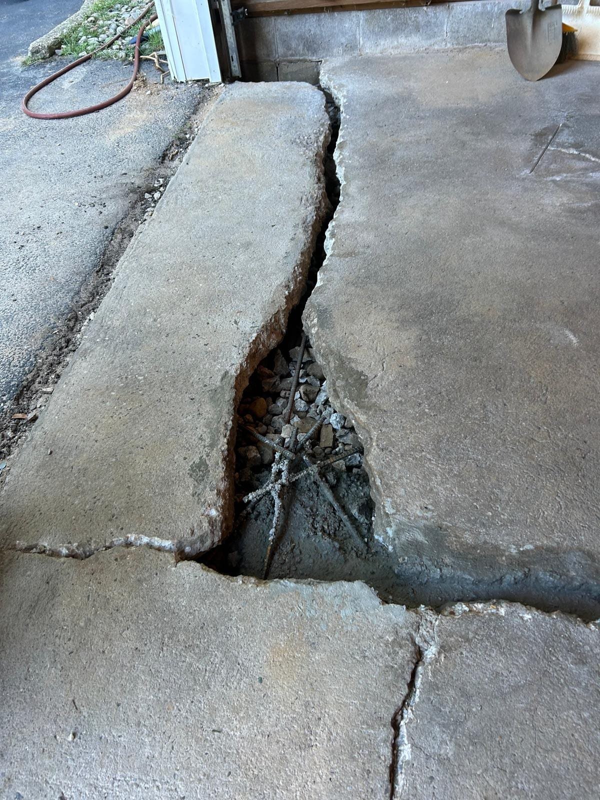 Job-site photo 1: foundation wall crack repair with carbon fiber grid and garage slab rebuild in Westport, CT