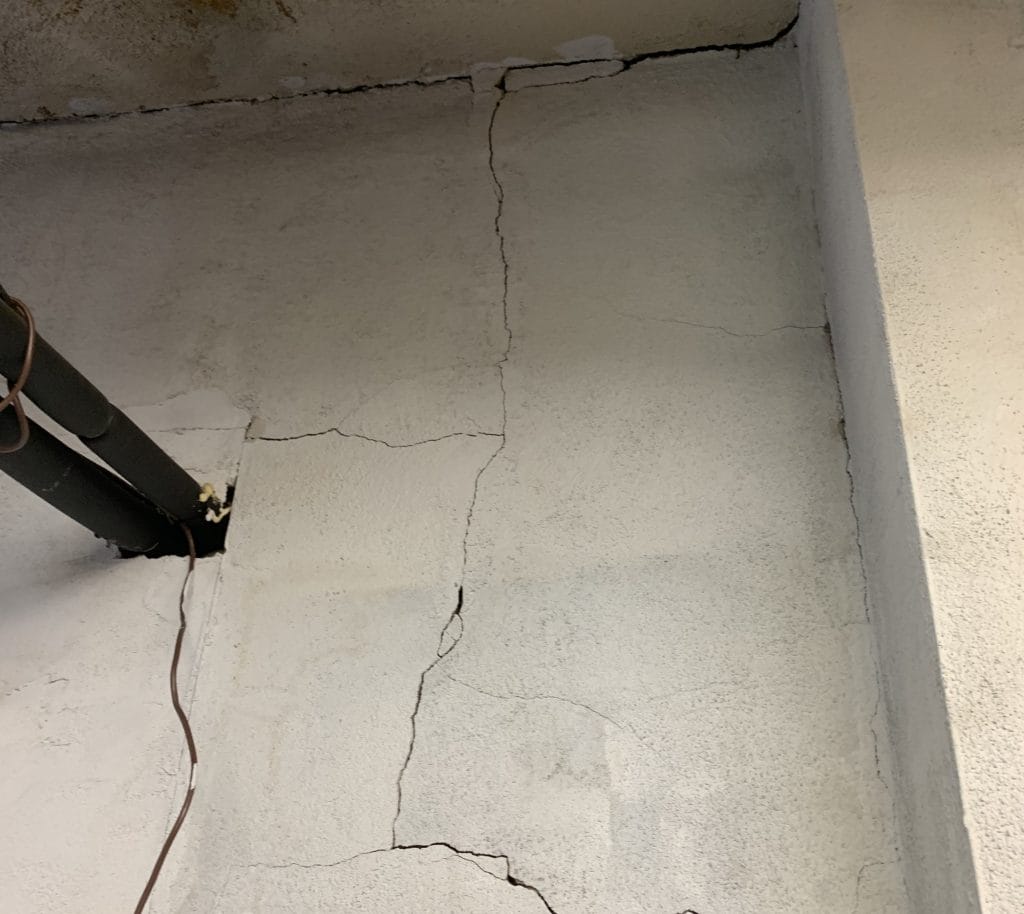 multiple cracks in wall clearly visible