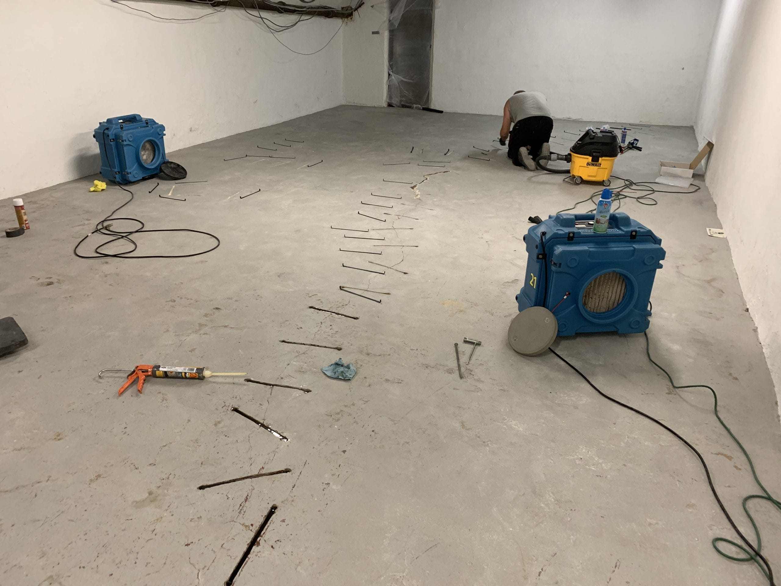 fixing a crack in the concrete slab with machinery around